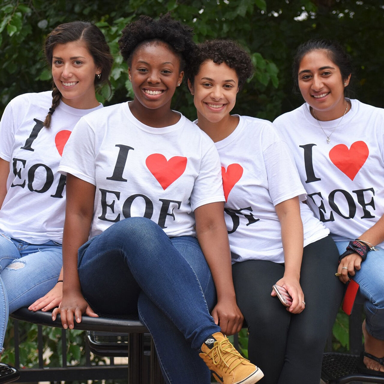 Four smiling students wearing I heart EOF t-shirts image number 0
