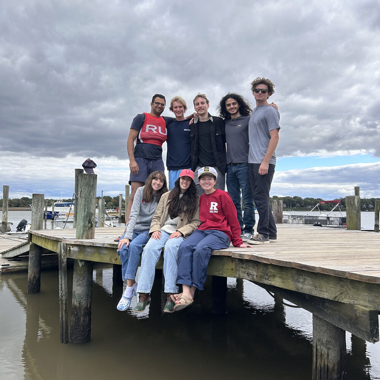 Rutgers Sailing Club students sitting on dock image number 0