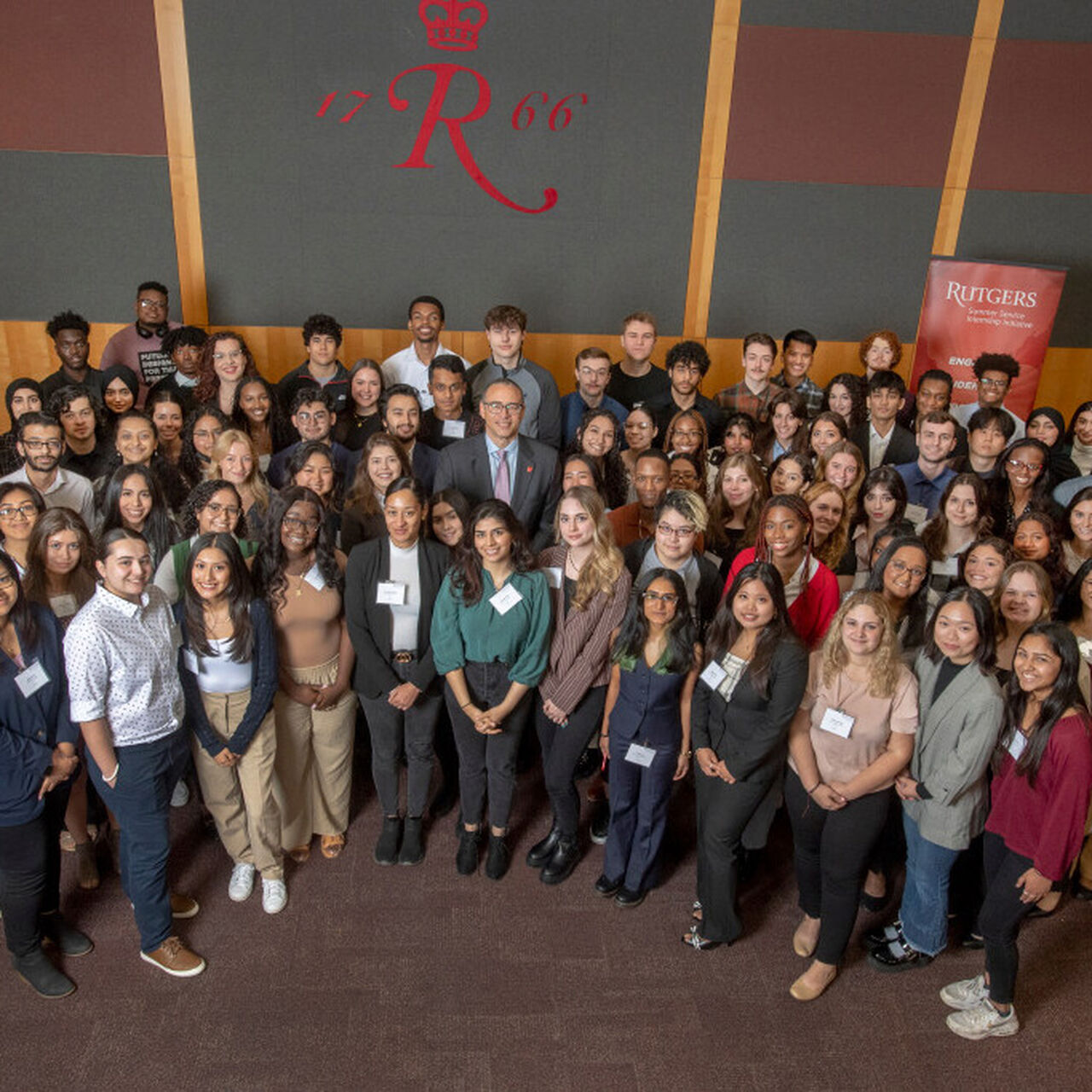 Rutgers President Jonathan Holloway standing with a group of RSSI students image number 0