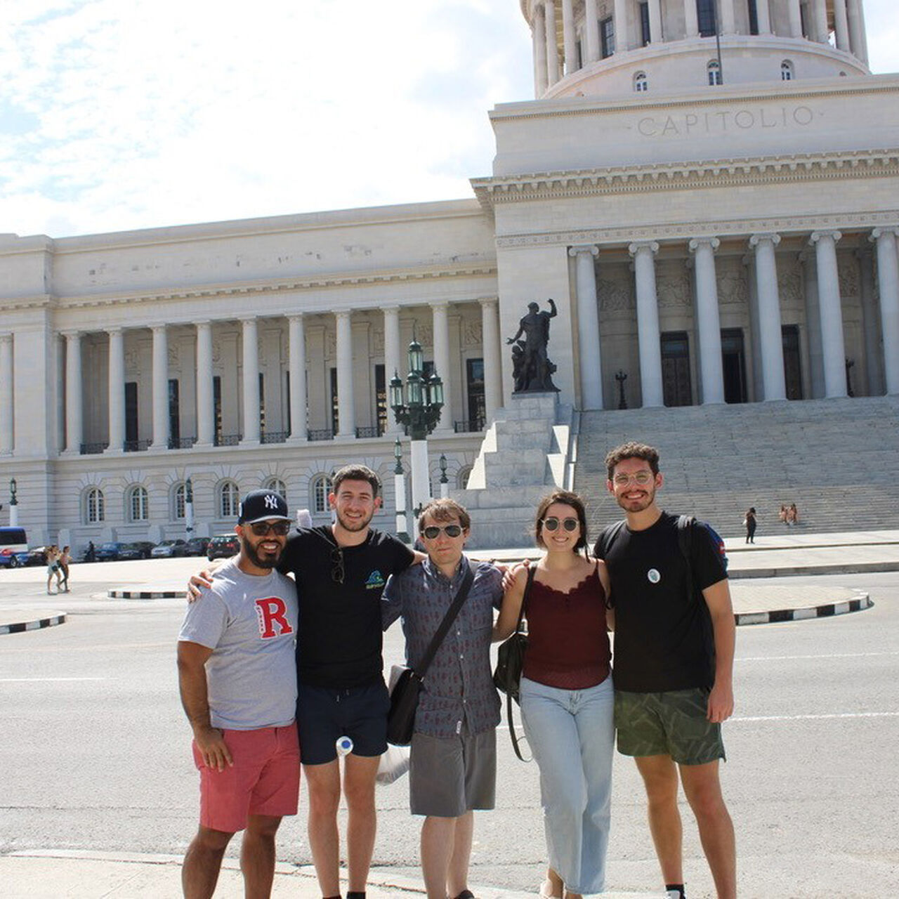 Rutgers Law School students smiling in a group in front of a government building in Cuba image number 0