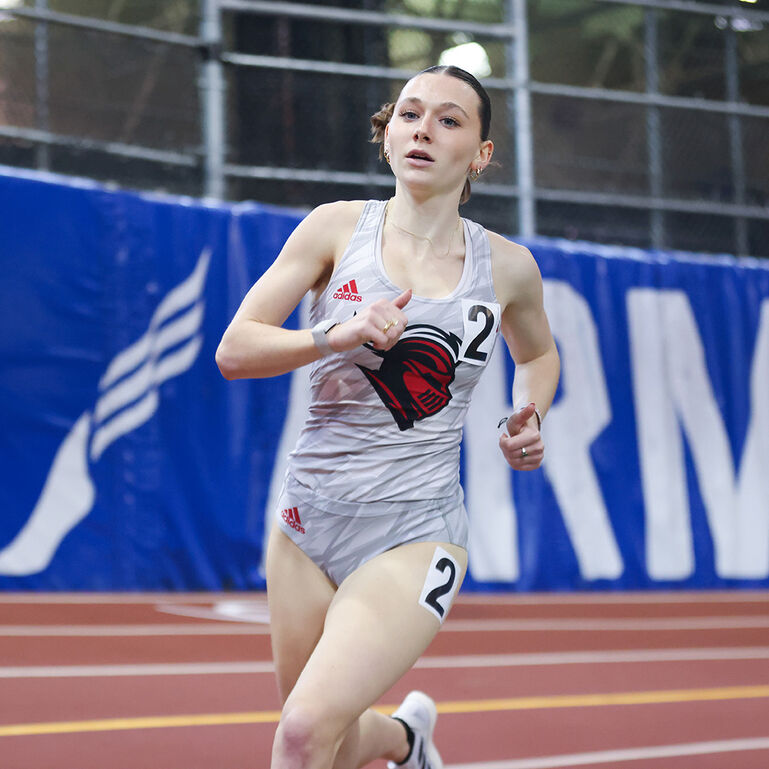 Scarlet Knight student-athlete running on an outdoor track