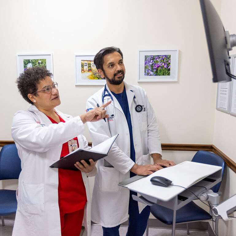 Two cancer researchers