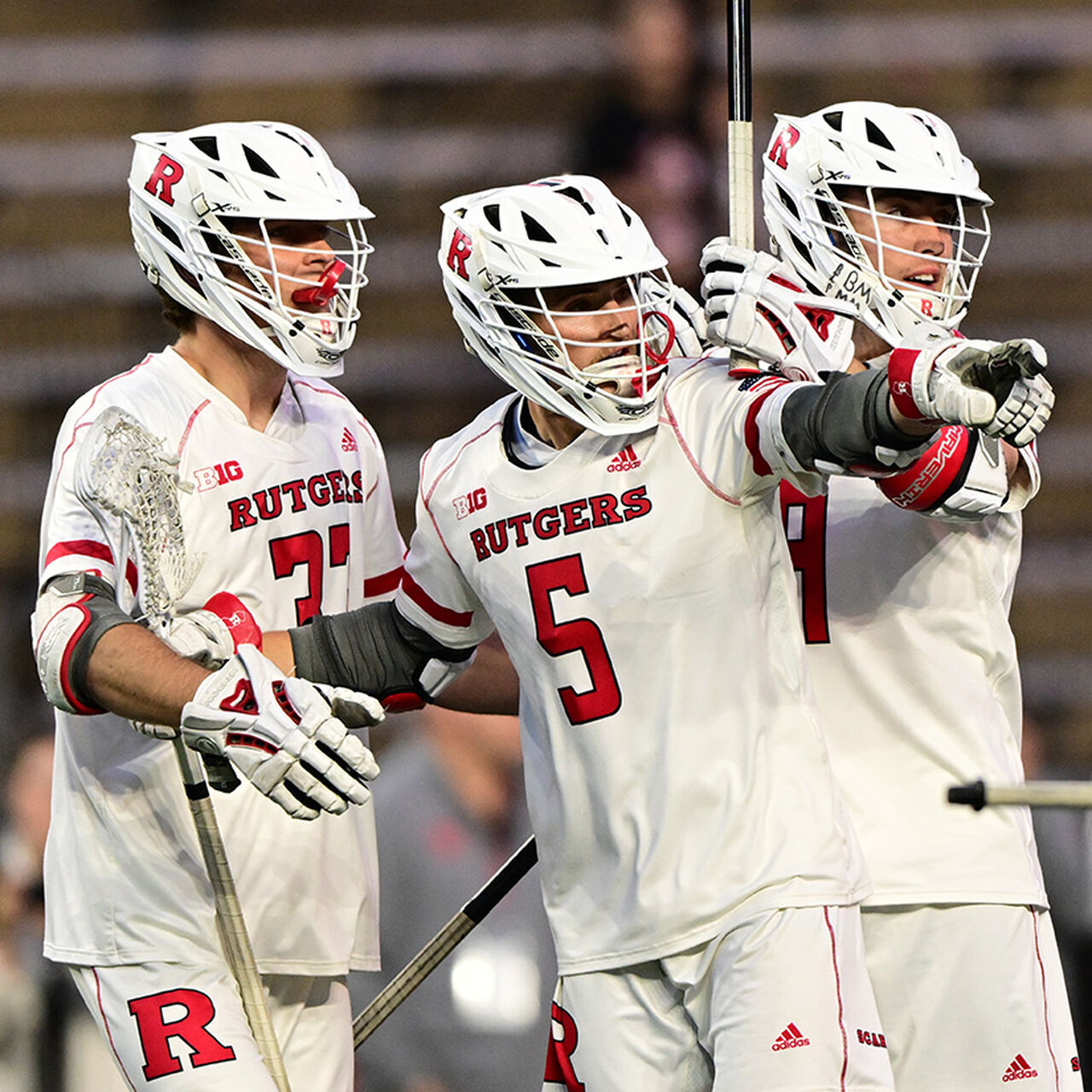 Three men's Lacrosse players image number 0