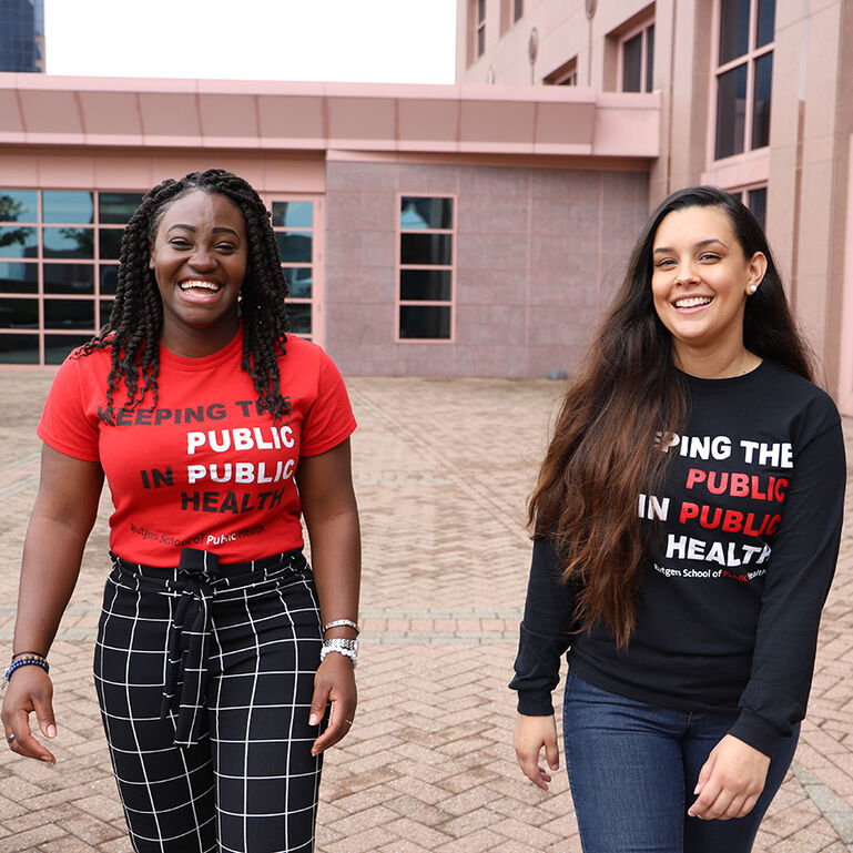Two smiling public health students