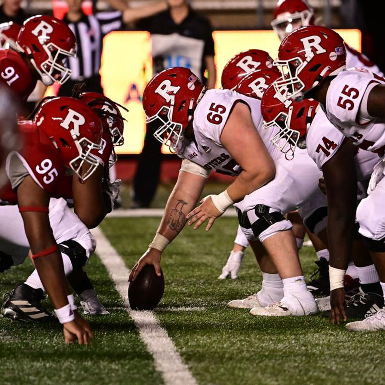 Rutgers Football players setting up the start of a play during the annual Scarlet and White game image number 0