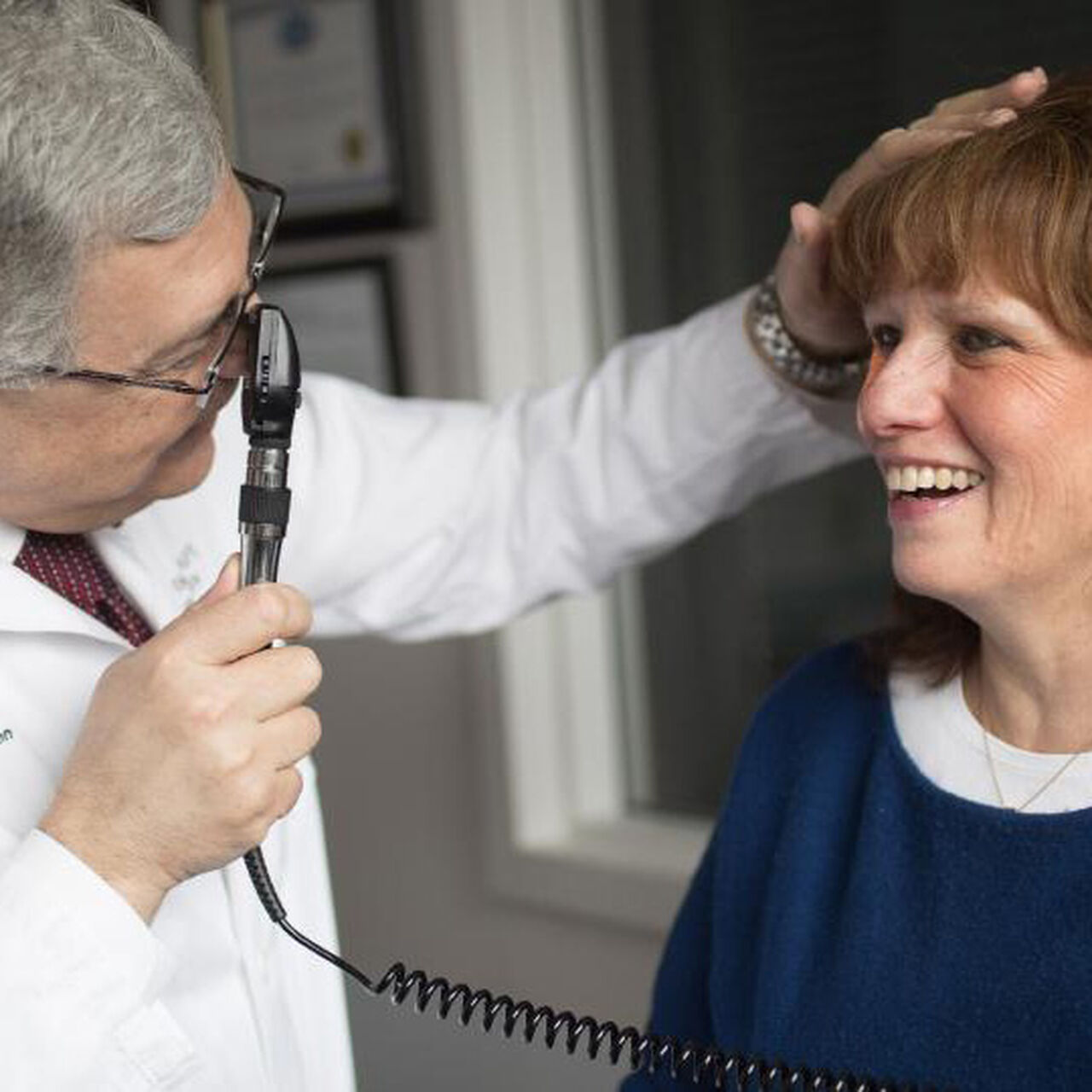 Physician giving a neurological exam image number 0