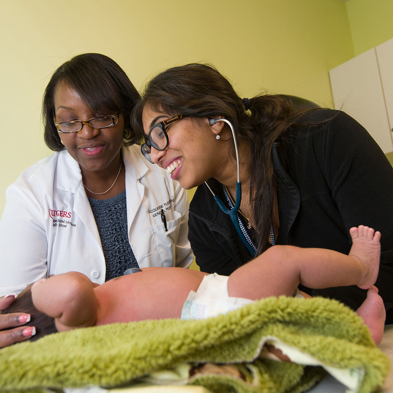 Two physicians examine a child image number 0