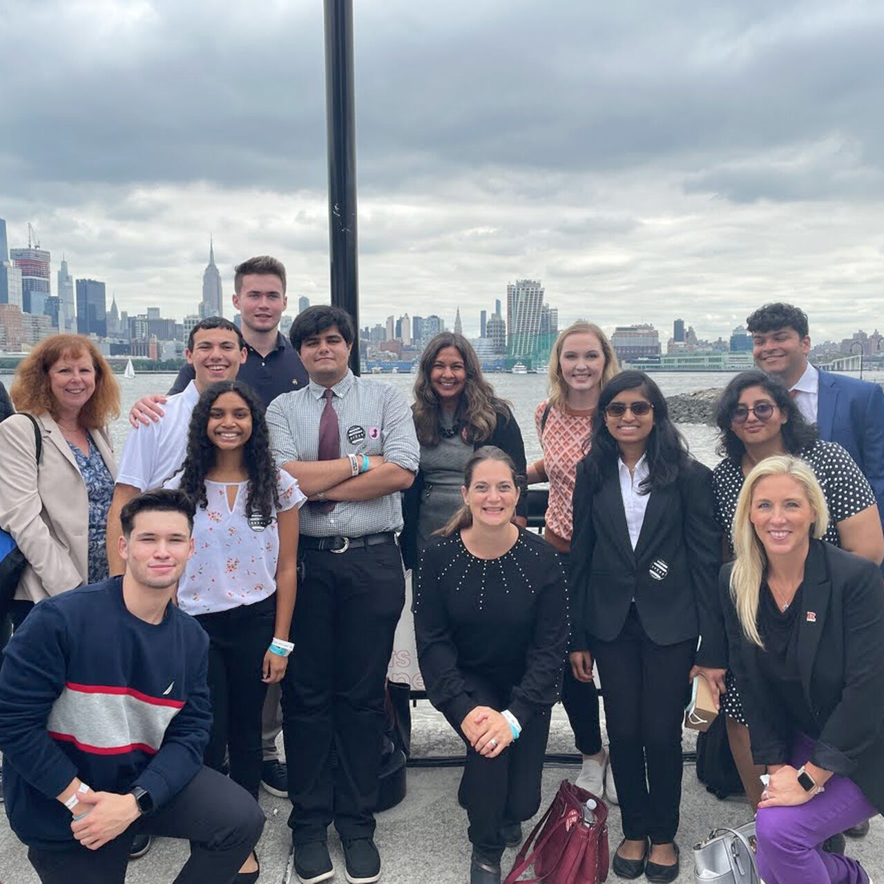 A group of students in front of a city skyline image number 0