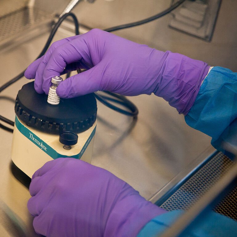 Pair of hands working in lab