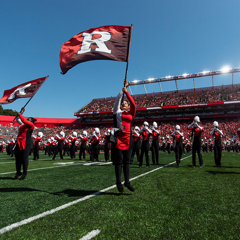 The Scarlet Knight Marching Band performing at Shi Stadium