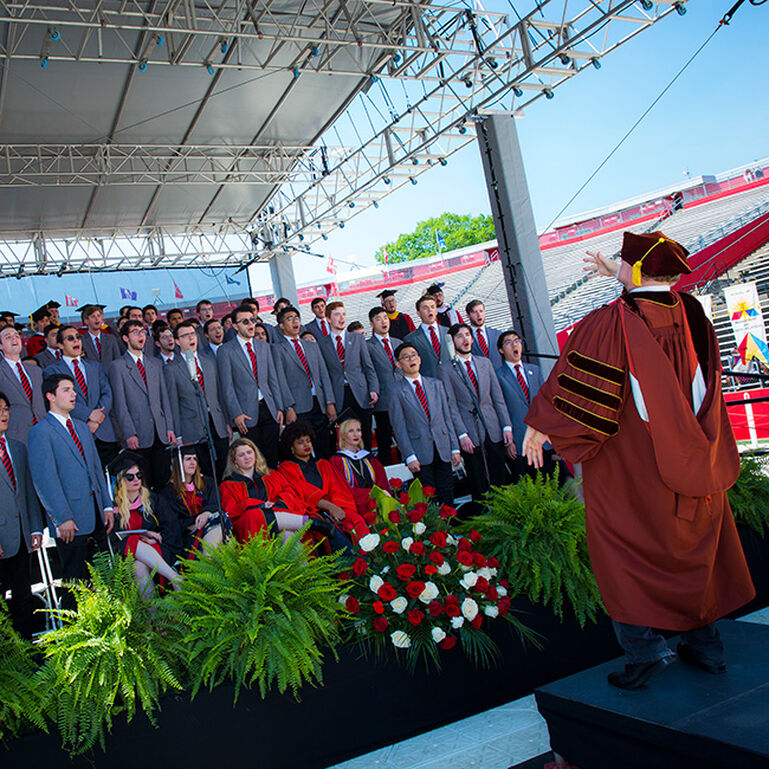 Glee Club singing on stage at Commencement