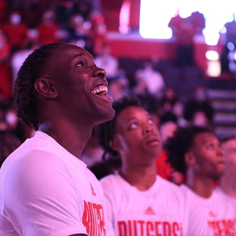 Rutgers Men's Basketball players smiling in Jersey Mike's arena before a game