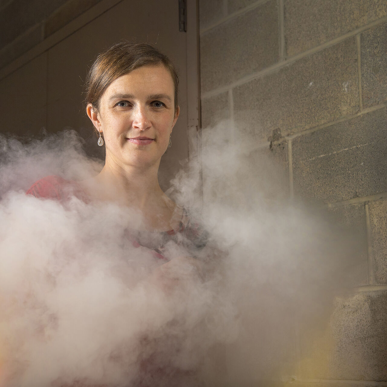 A person posing for the camera in a cloud of cigarette smoke image number 0