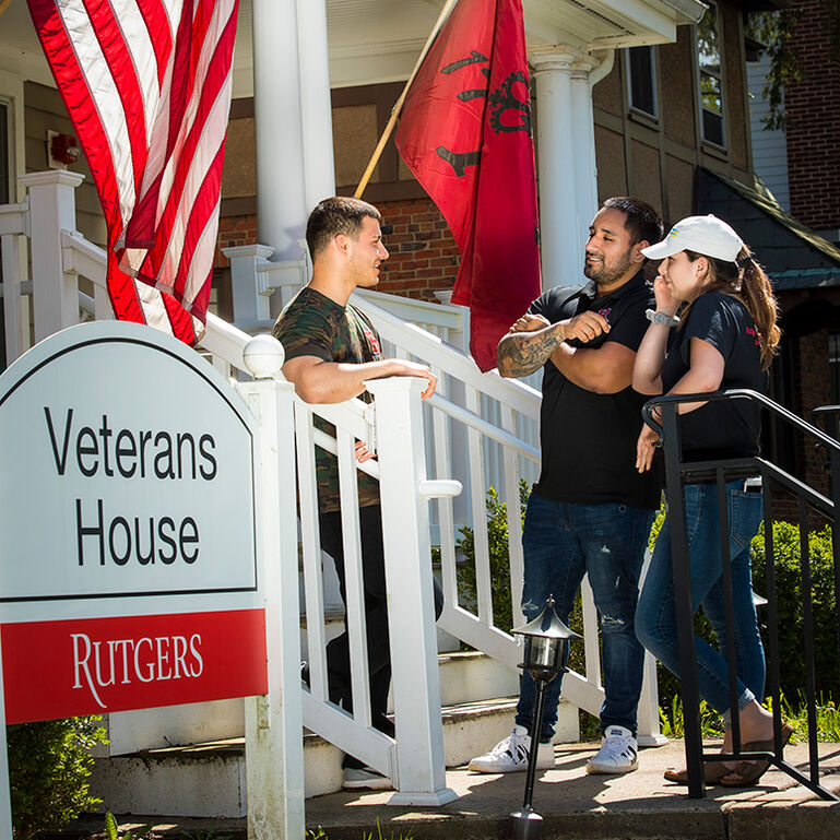 Students talking outside Veteran's House at Rutgers