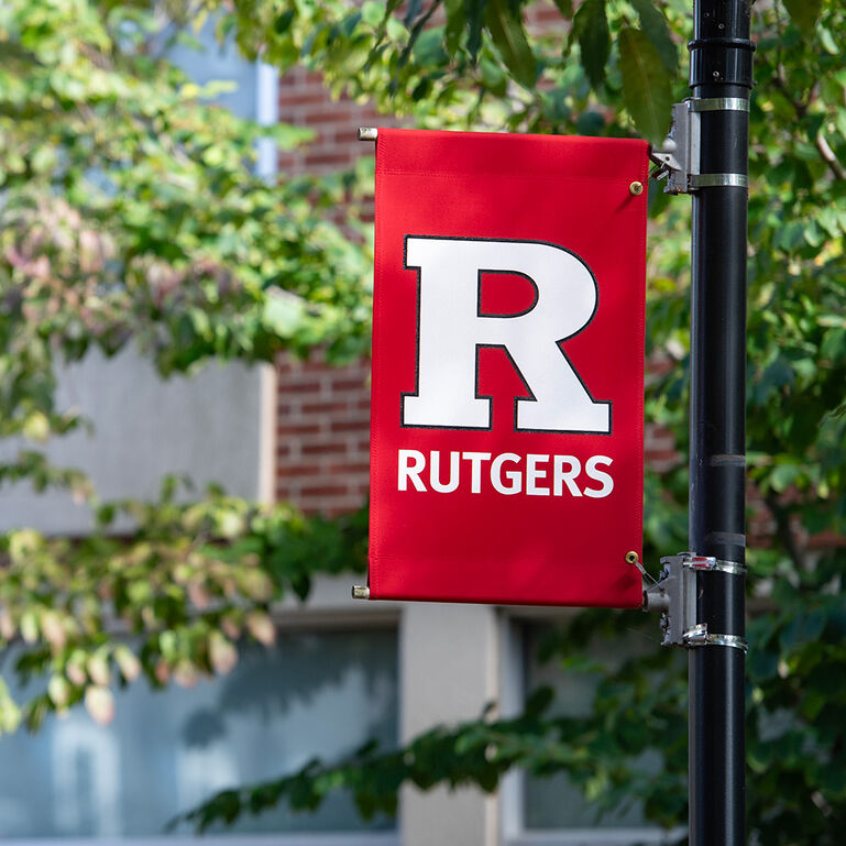 Block R Rutgers banner hanging on a light post