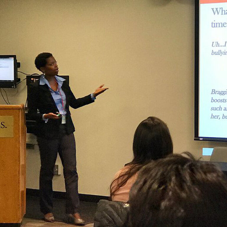 Dr. Stacia Gilliard-Matthews lecturing to students in a classroom