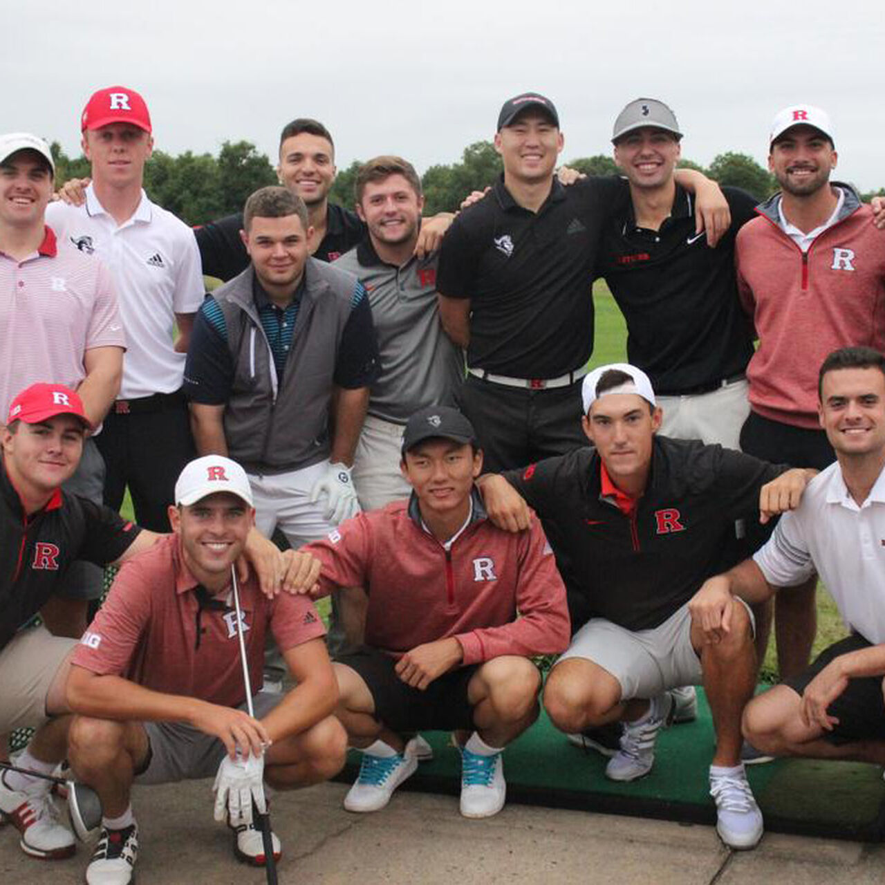 Rutgers Men's Golf players posing in a group on the green image number 0