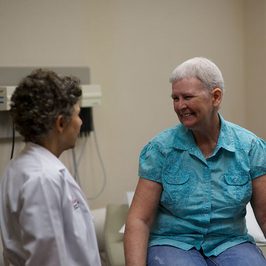 Rutgers Cancer Institute physician speaking with patient image number 1