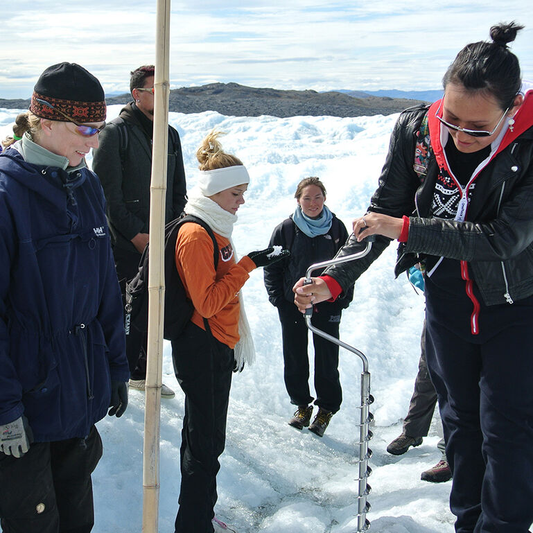Group of researchers working in the snow and ice