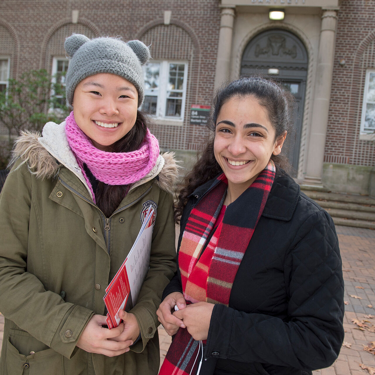 2 students smiling and posing outside on the Rutgers-New Brunswick campus image number 0