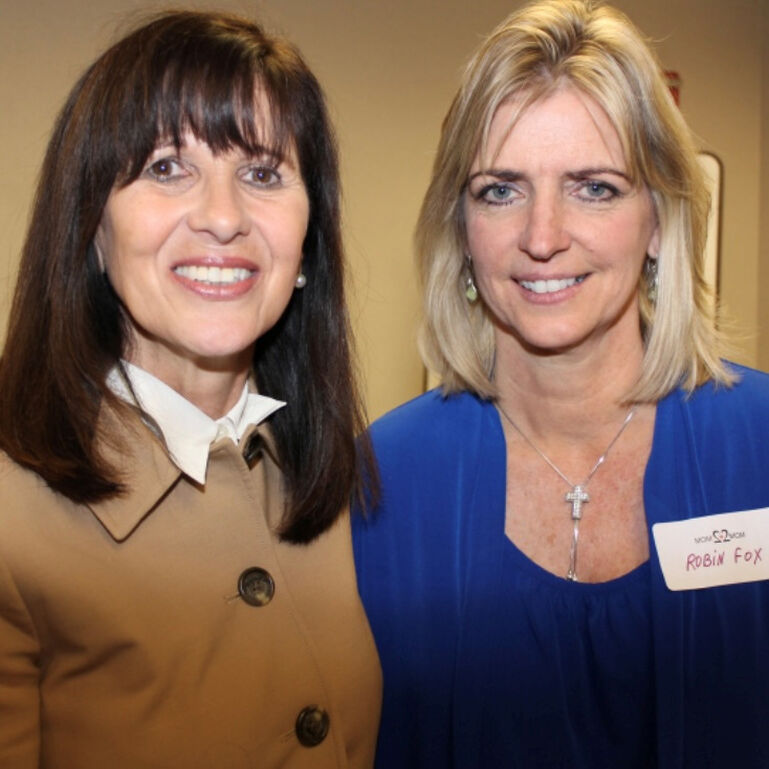 Two women smiling at the camera