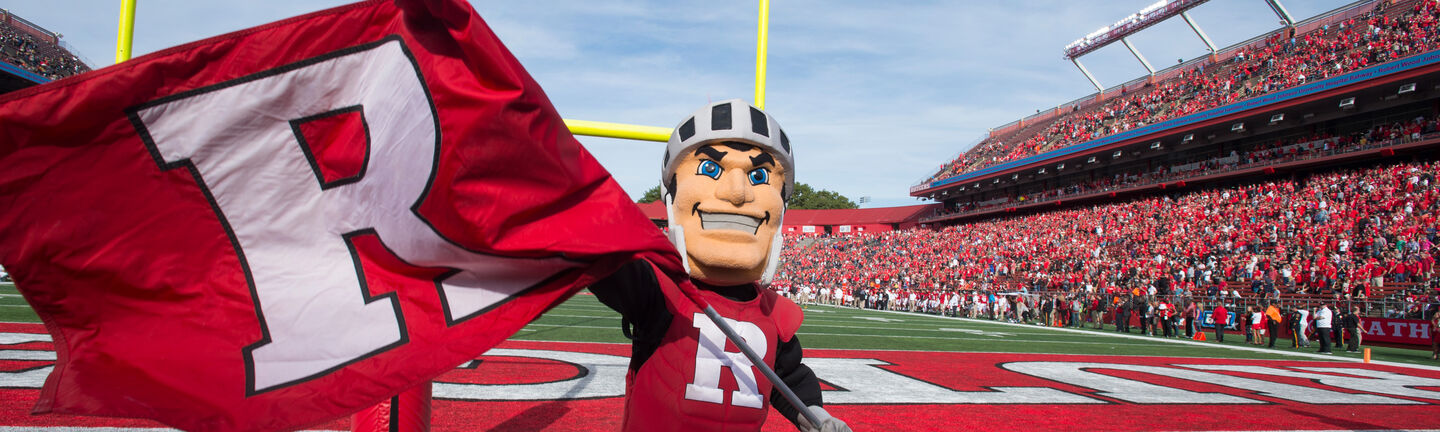 Sir Henry waving a Block R flag in the Rutgers end zone at SHI Stadium