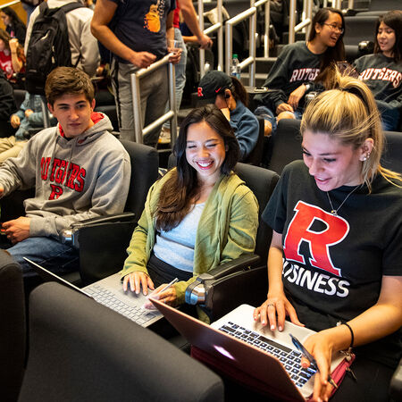 Students working in laptops in lecture hall at Rutgers-Newark